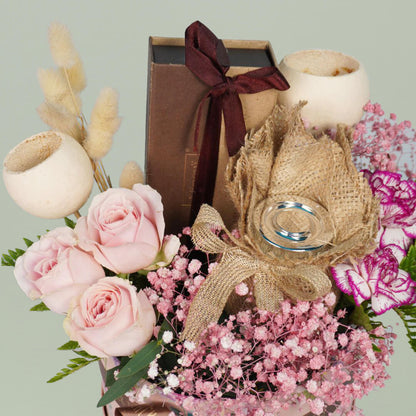 Diwali festive flower hamper with assorted roses carnations chocolates cashews and candle gift