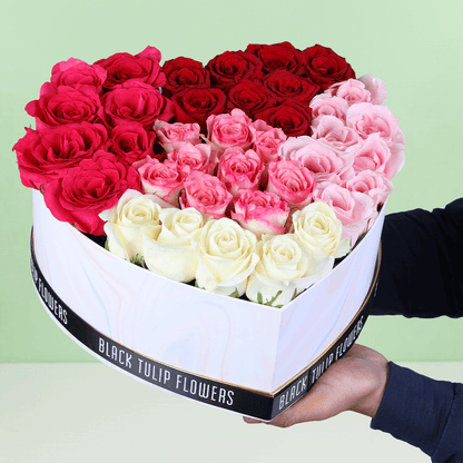 Cupid’s Mixed Rose Heart Box arranged with red, pink and white roses