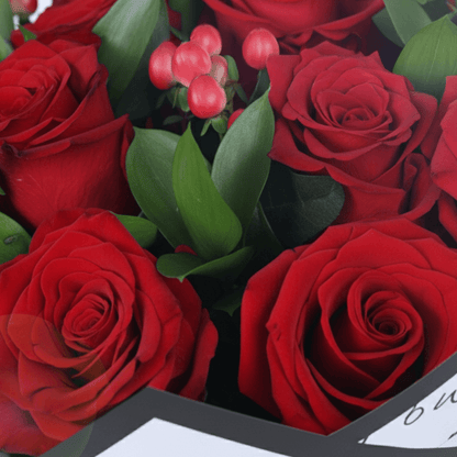 Red Romance Rose Bouquet arranged with red roses, berries and fresh fillers