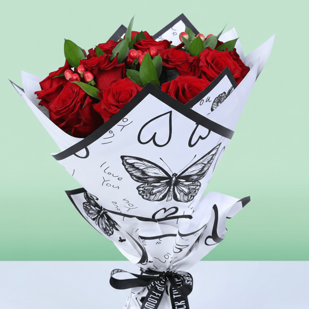 Red Romance Rose Bouquet arranged with red roses, berries and fresh fillers
