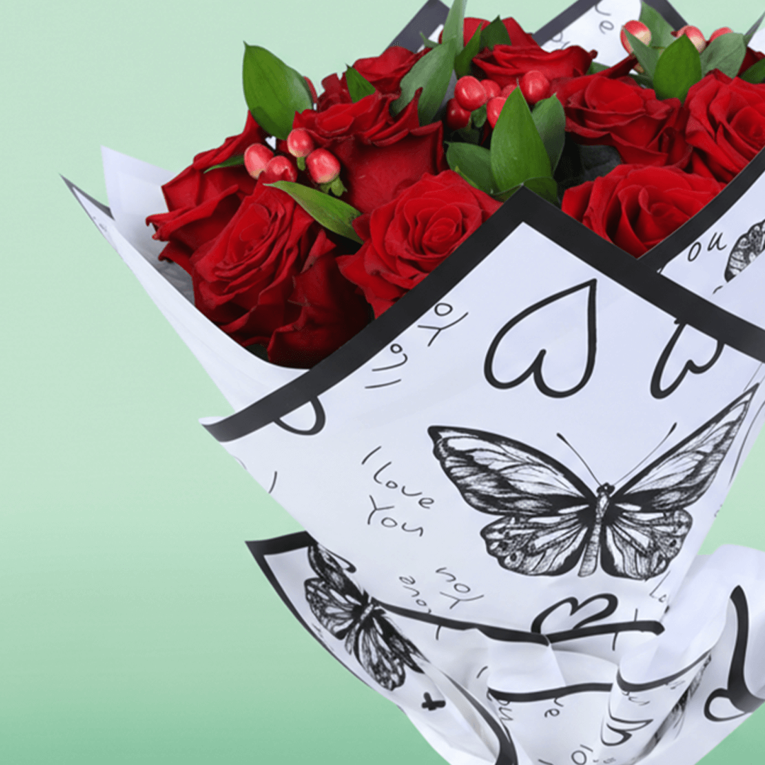 Red Romance Rose Bouquet arranged with red roses, berries and fresh fillers