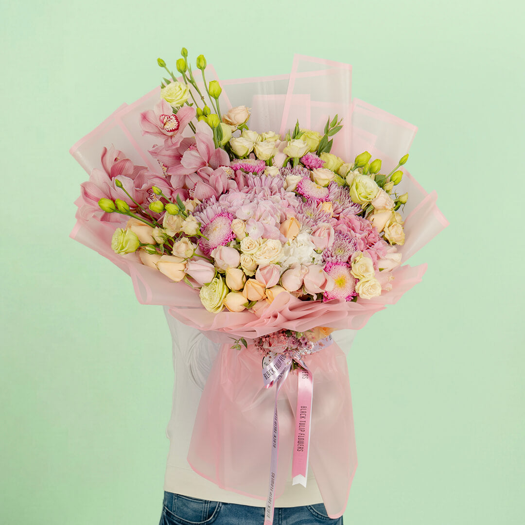 Luxury mixed flower bouquet with cymbidium, hydrangea, roses and Korean wrapping