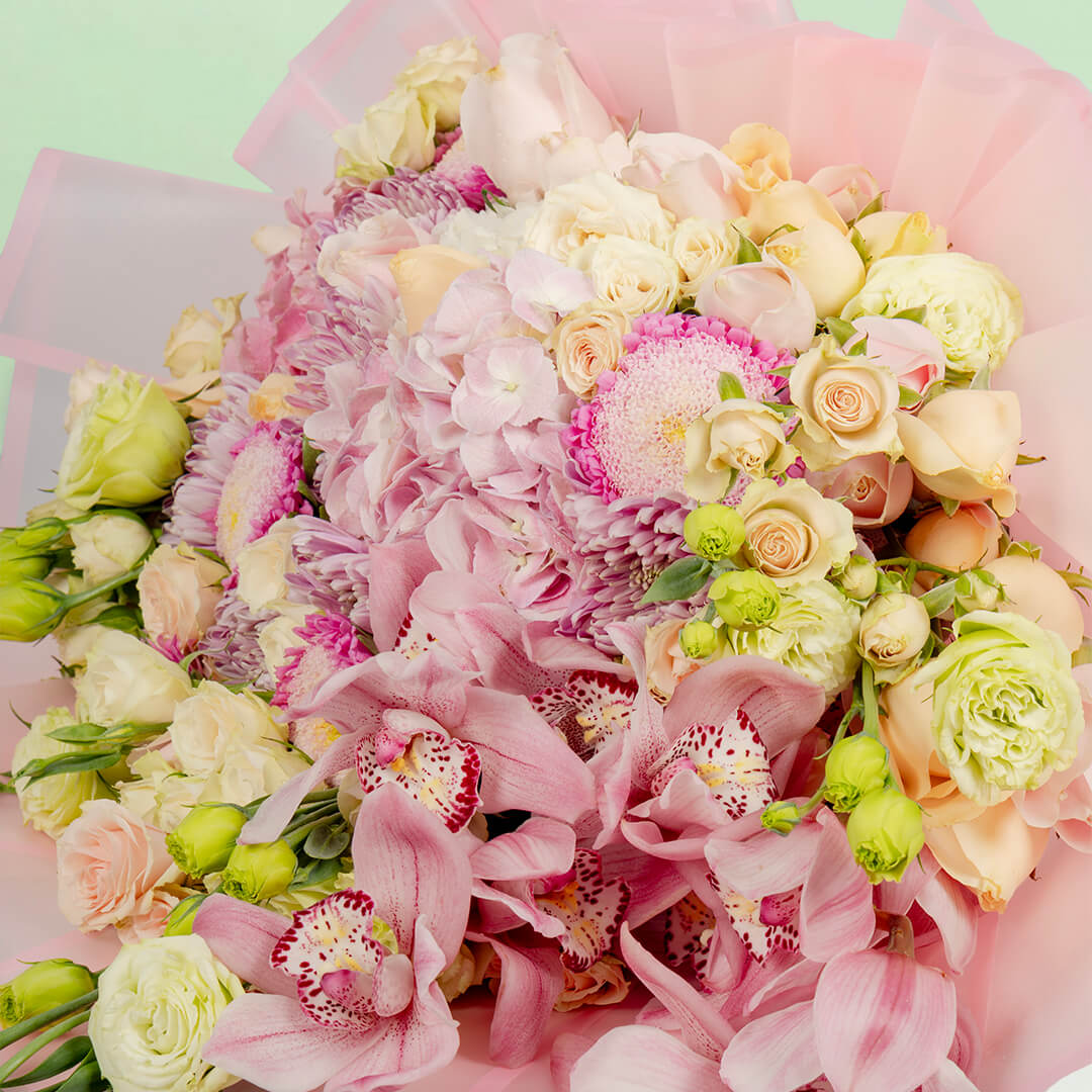 Luxury mixed flower bouquet with cymbidium, hydrangea, roses and Korean wrapping