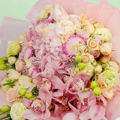 Luxury mixed flower bouquet with cymbidium, hydrangea, roses and Korean wrapping