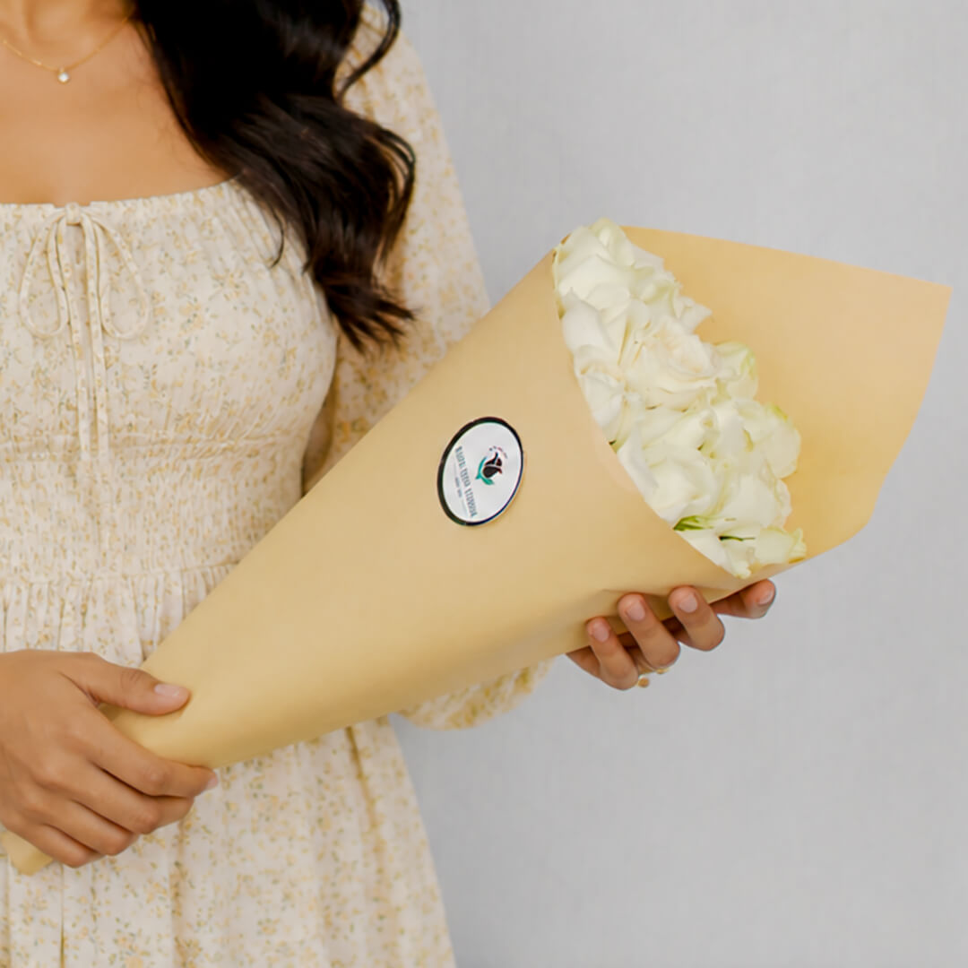 Premium cut sunflowers wrapped in a protective sleeve for fresh flower arrangements.