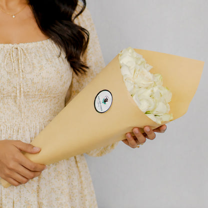 Premium cut sunflowers wrapped in a protective sleeve for fresh flower arrangements.