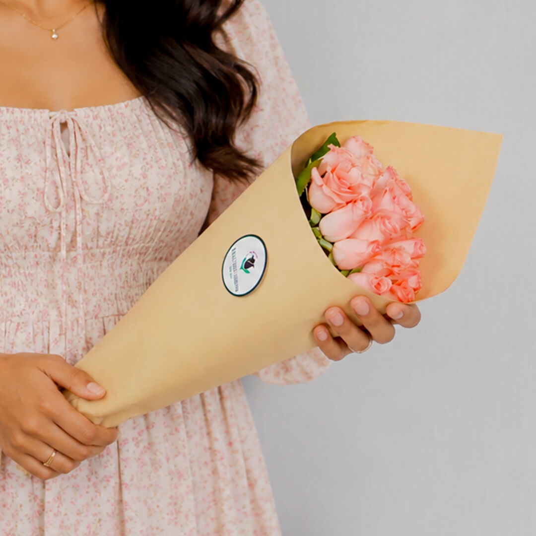 Premium cut sunflowers wrapped in a protective sleeve for fresh flower arrangements.