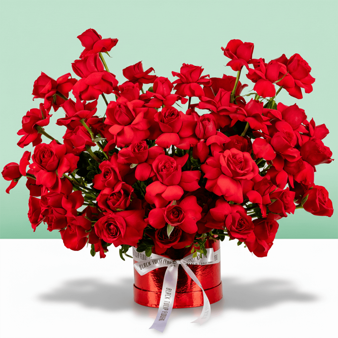 Classic red rose bloom box arranged in premium round red flower box