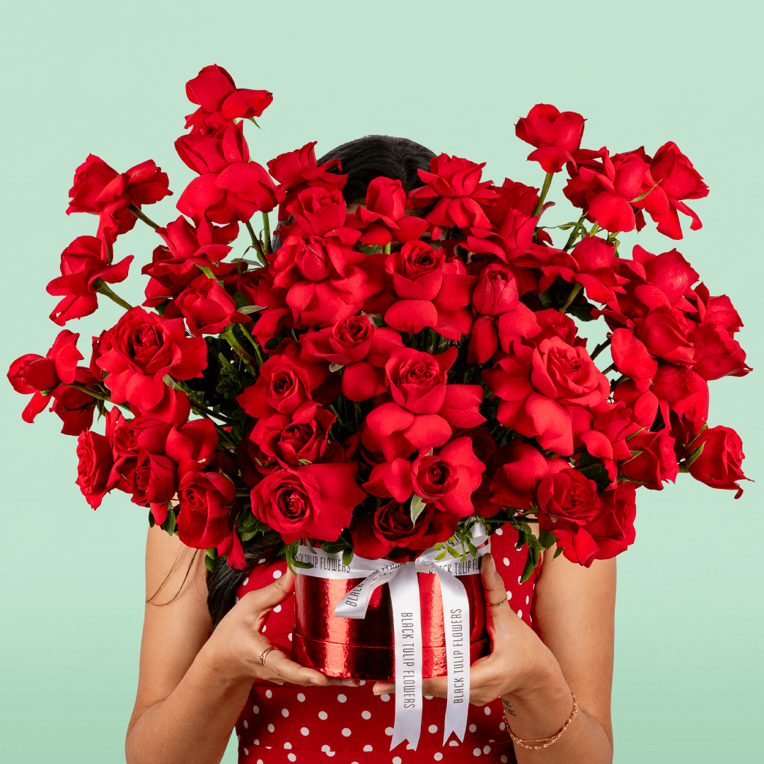 Classic red rose bloom box arranged in premium round red flower box
