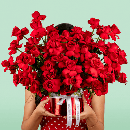 Classic red rose bloom box arranged in premium round red flower box