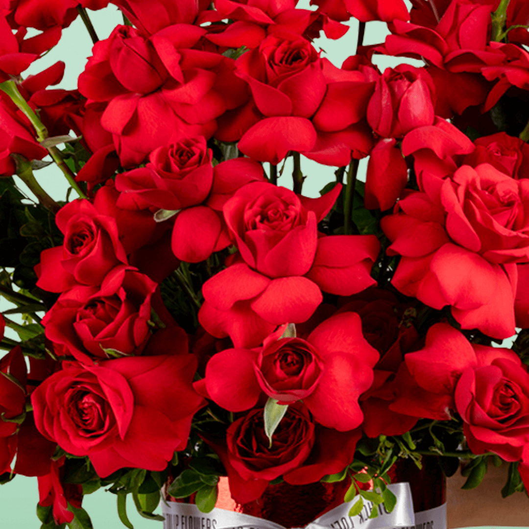 Classic red rose bloom box arranged in premium round red flower box