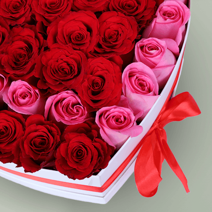 Love Bloom Rose Heart Box arranged with red and pink roses