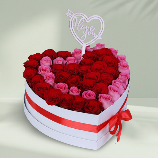 Love Bloom Rose Heart Box arranged with red and pink roses