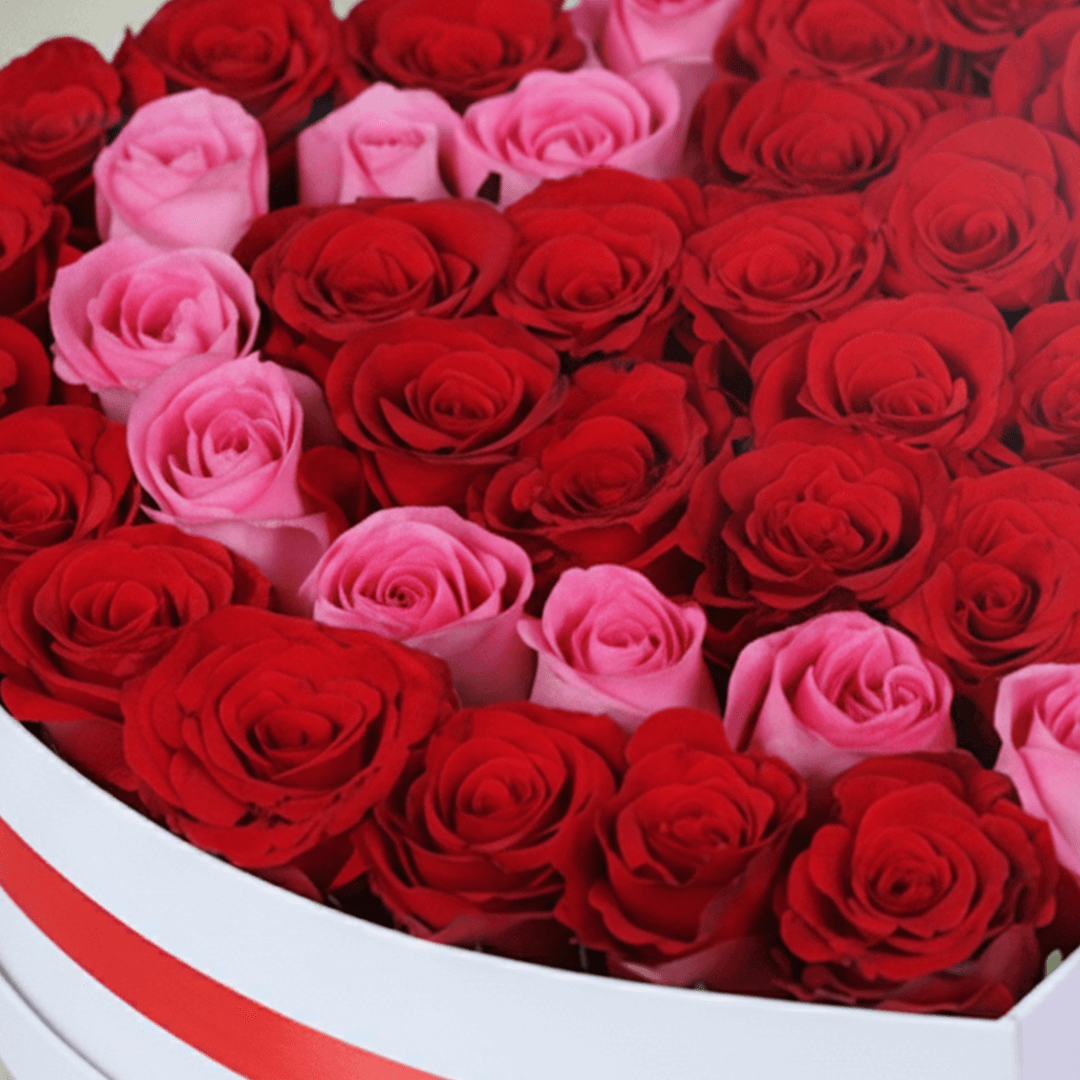Love Bloom Rose Heart Box arranged with red and pink roses