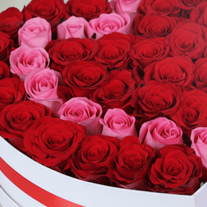 Love Bloom Rose Heart Box arranged with red and pink roses