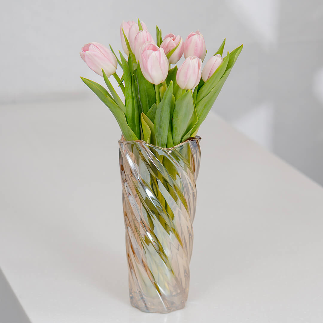 Fresh light pink cut tulip flowers in a bouquet with soft blush petals