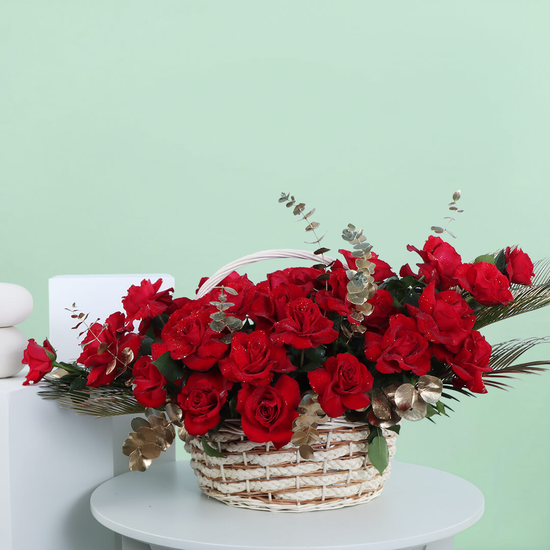 Luxurious Love basket with 30 red roses, fresh eucalyptus and decorative foliage for romantic celebrations