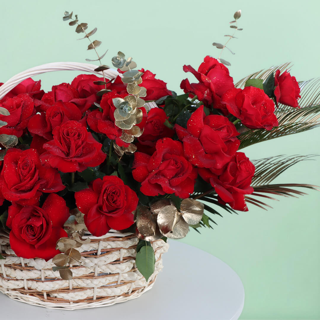 Luxurious Love basket with 30 red roses, fresh eucalyptus and decorative foliage for romantic celebrations