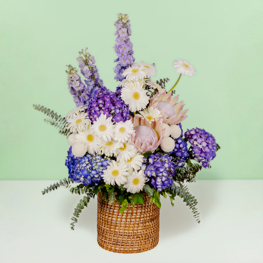 Luxury assorted flower basket with protea, hydrangea, gerberas and eucalyptus