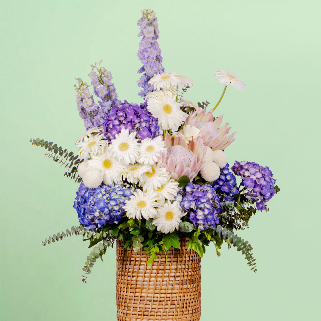 Luxury assorted flower basket with protea, hydrangea, gerberas and eucalyptus