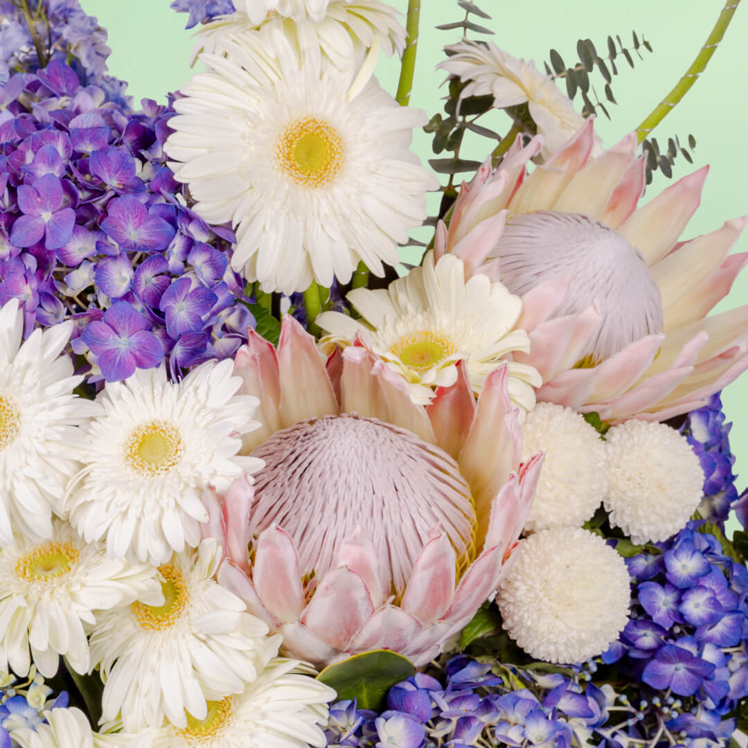 Luxury assorted flower basket with protea, hydrangea, gerberas and eucalyptus