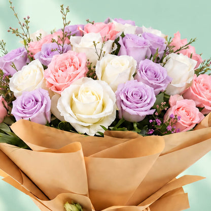 Mixed-colour roses arranged in a bouquet with non-woven wrapping