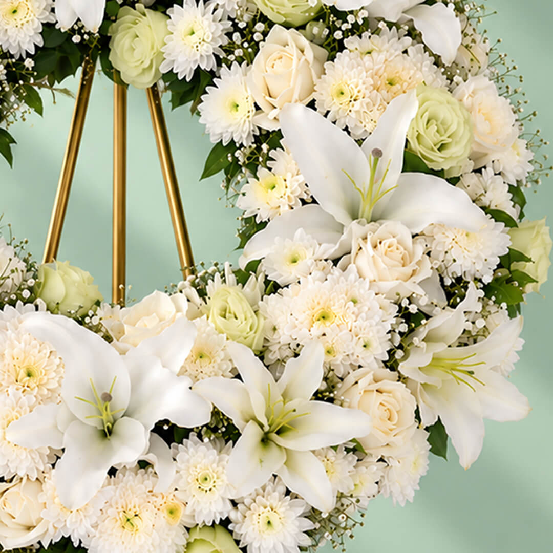 Assorted floral wreath ring with lilies, eustoma, roses, chrysanthemums, disbuds and green leaves