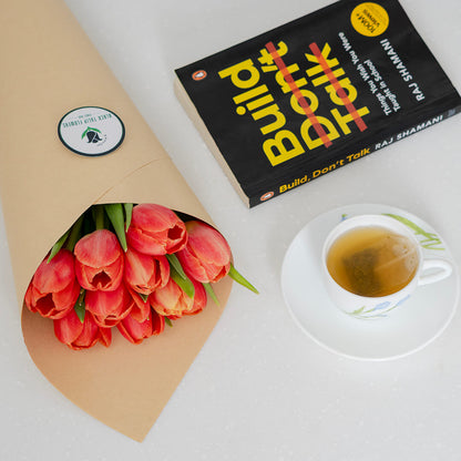 Vibrant orange cut tulips with rich citrus petals arranged in a vase