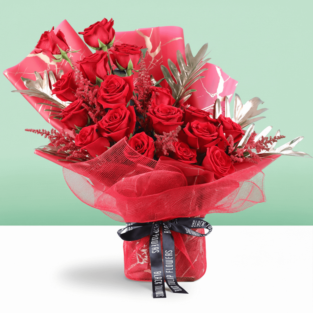 Crimson Passion Red Floral Bouquet arranged with red roses with lush greenery and seasonal red accents