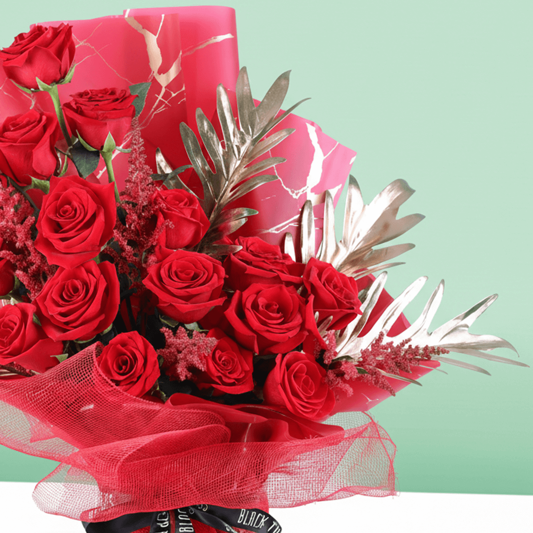 Crimson Passion Red Floral Bouquet arranged with red roses with lush greenery and seasonal red accents