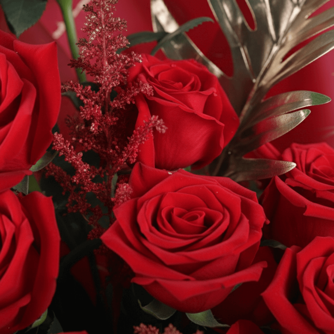 Crimson Passion Red Floral Bouquet arranged with red roses with lush greenery and seasonal red accents