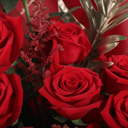 Crimson Passion Red Floral Bouquet arranged with red roses with lush greenery and seasonal red accents
