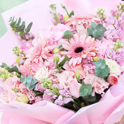 Mixed flower bouquet with hydrangeas, roses, gerberas, eustoma, snapdragons and greenery