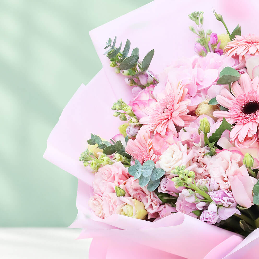 Mixed flower bouquet with hydrangeas, roses, gerberas, eustoma, snapdragons and greenery