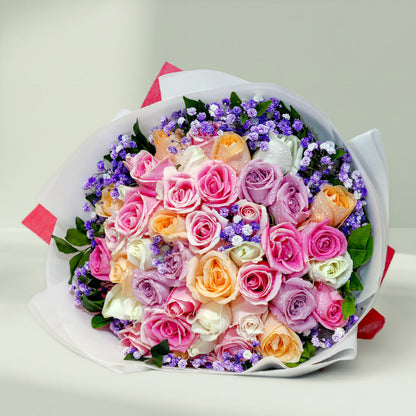 Assorted pastel roses and gypsophila bouquet with pink, peach, lavender, white and cream flowers