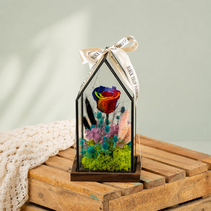 Preserved rainbow rose with dried flowers displayed elegantly in a decorative glass dome