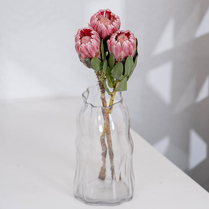 Queen Protea cut flower with sculptural layered bracts in vibrant pink for elegant floral arrangements