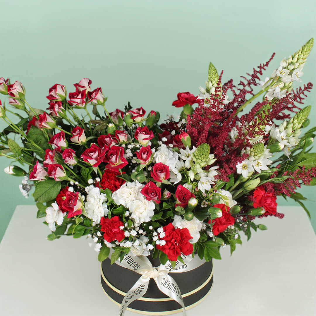 Radiant red flower bouquet with fresh roses arranged beautifully for gifting and special occasions