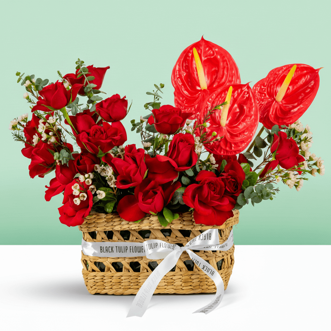 Crimson Red Rose & Anthurium Basket arranged with red roses, red anthurium and fresh foliage