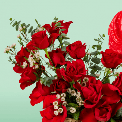 Crimson Red Rose & Anthurium Basket arranged with red roses, red anthurium and fresh foliage