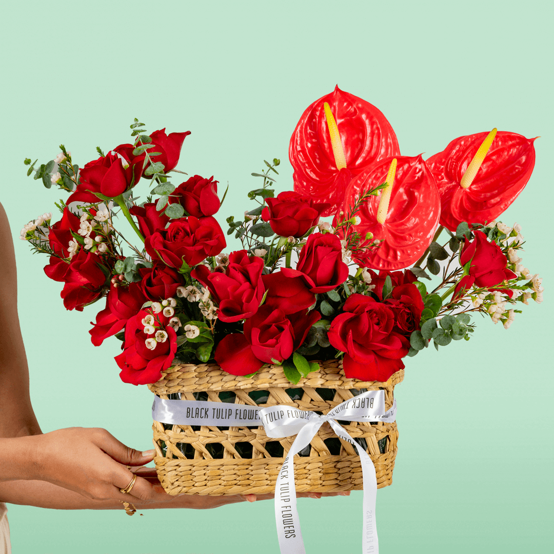 Crimson Red Rose & Anthurium Basket arranged with red roses, red anthurium and fresh foliage