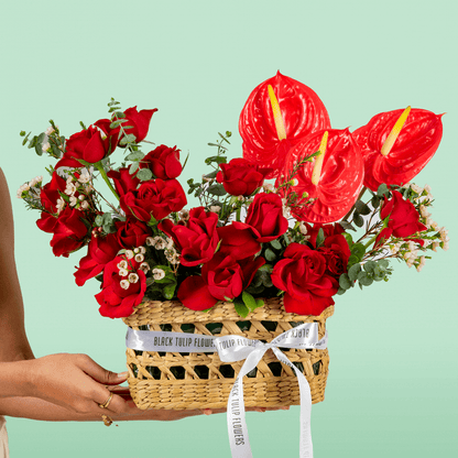 Crimson Red Rose & Anthurium Basket arranged with red roses, red anthurium and fresh foliage