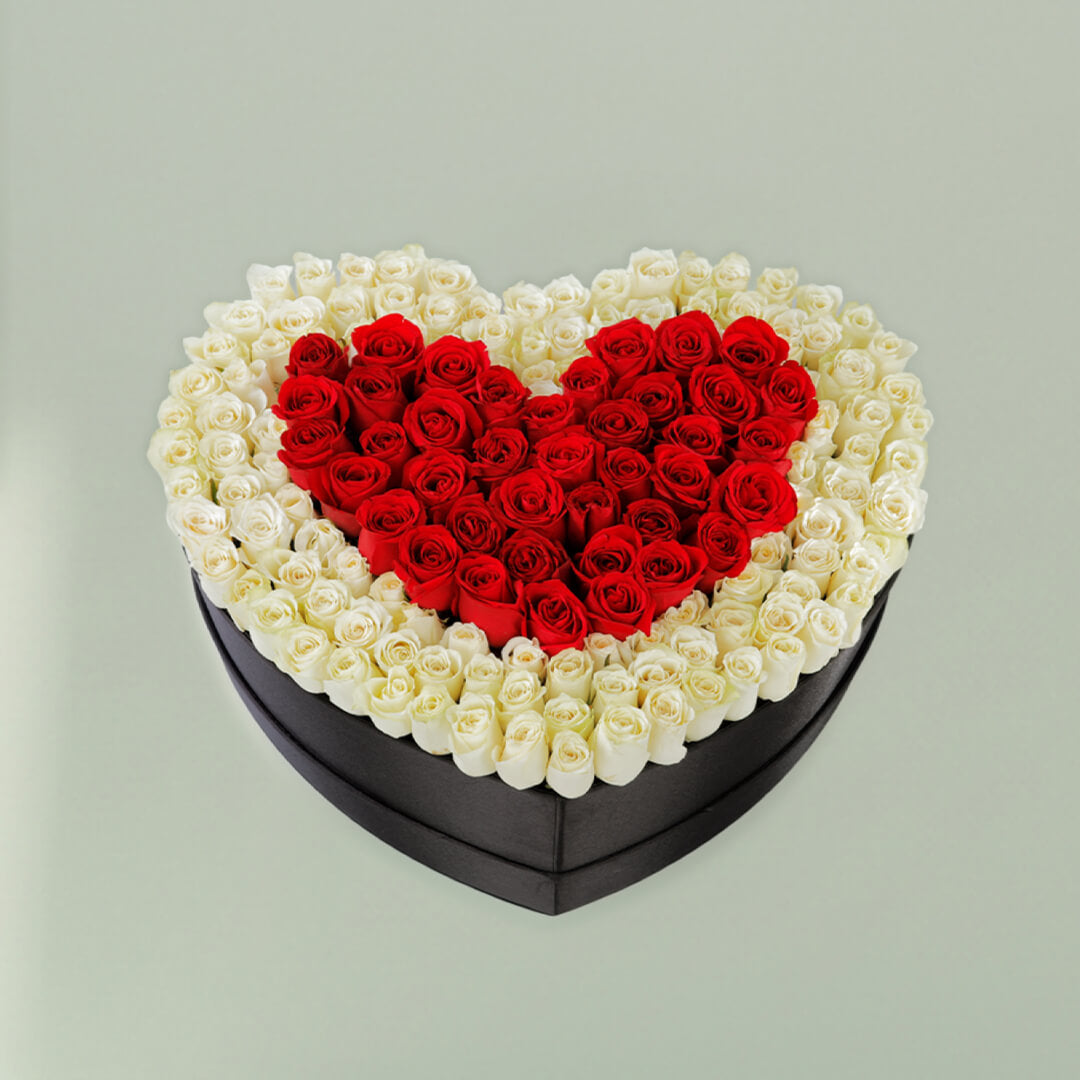Red heart rose flower box with fresh red roses arranged beautifully for romantic gifting occasions