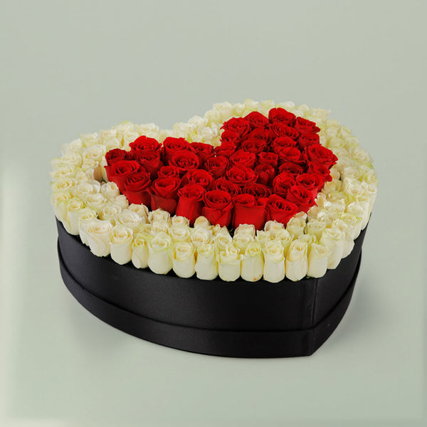 Red heart rose flower box with fresh red roses arranged beautifully for romantic gifting occasions