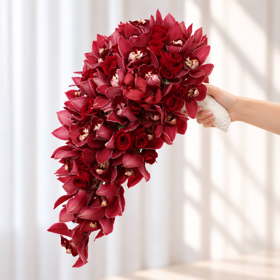 4 Red Cymbidium orchid stems wedding bouquet in a flowing cascade design
