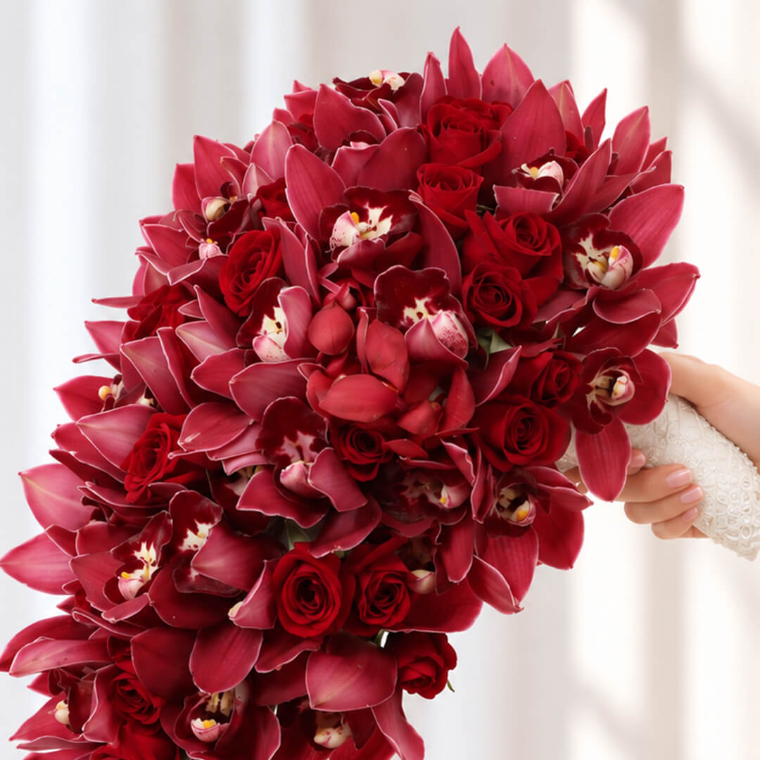 4 Red Cymbidium orchid stems wedding bouquet in a flowing cascade design