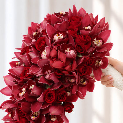 4 Red Cymbidium orchid stems wedding bouquet in a flowing cascade design