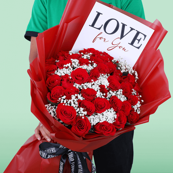 Passionate Red Whisper Bouquet arranged with 35 red roses with delicate gypso