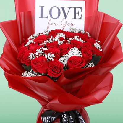 Passionate Red Whisper Bouquet arranged with 35 red roses with delicate gypso