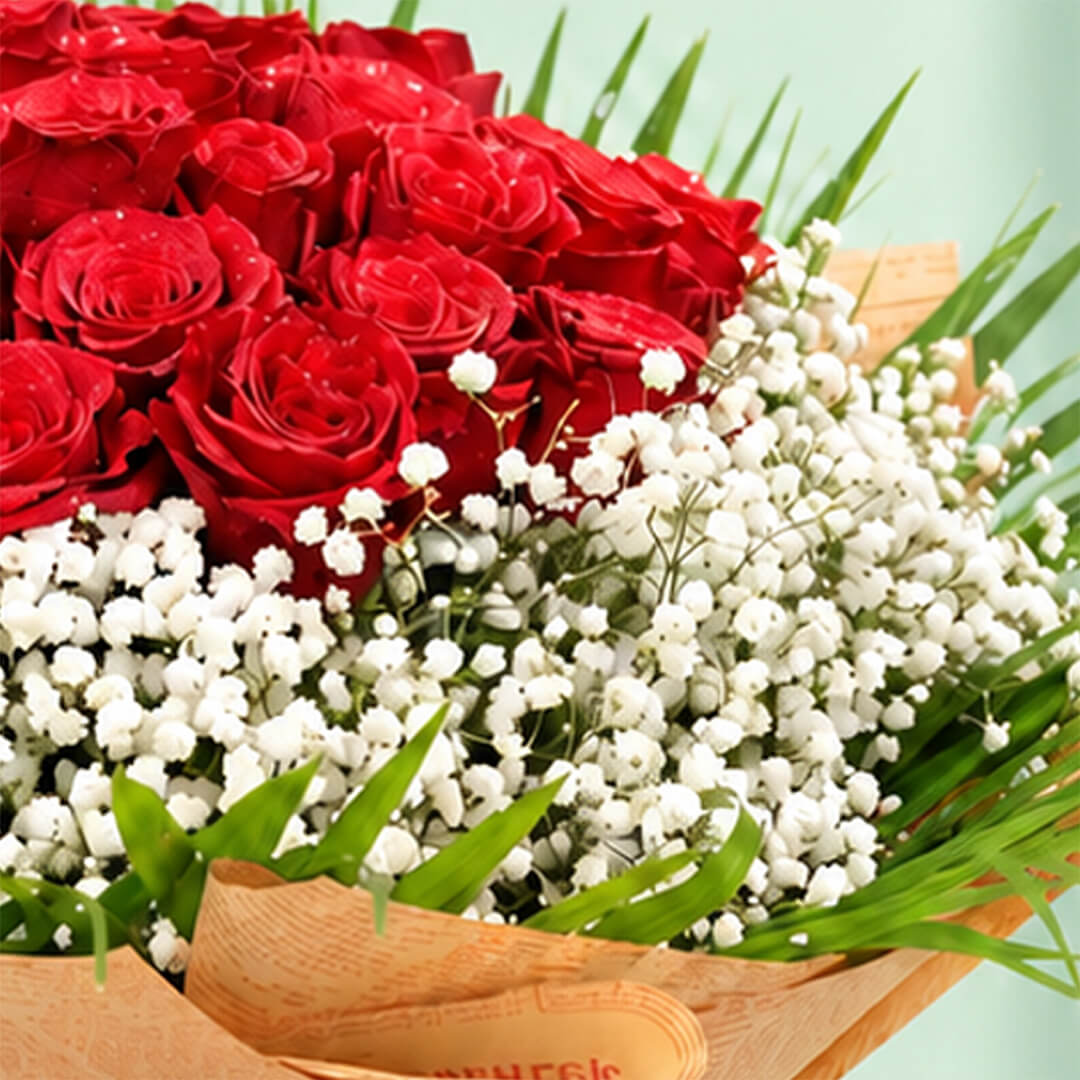 A bouquet featuring 30 red roses with delicate white gypso flowers nestled between the roses and a neat non-woven paper finish